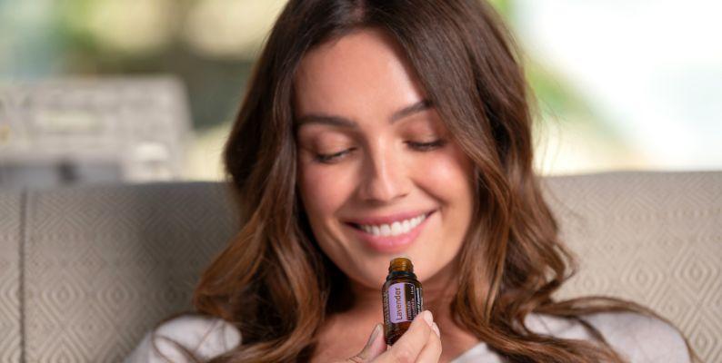 woman using lavender essential oil for health benefits