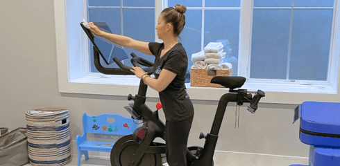 Cs Website Employee cleaning exercise bike